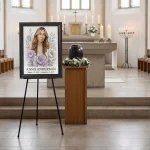 Personalised memorial portrait with floral motif made from photo, displayed at funeral service