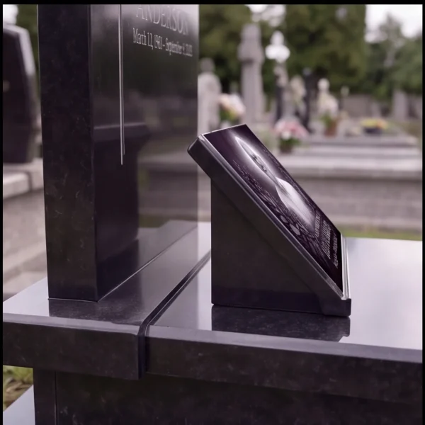 glass photo plaque for grave mounted on black granite headstone