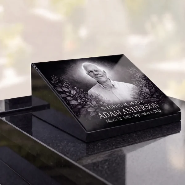 glass photo plaque for grave with engraved portrait, name and dates on granite headstone