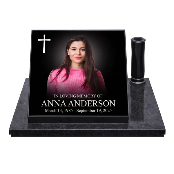Glass photo plaque for grave featuring portrait, cross, name and dates on granite base