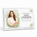 Glass photo plaque for grave with name and dates on marble base