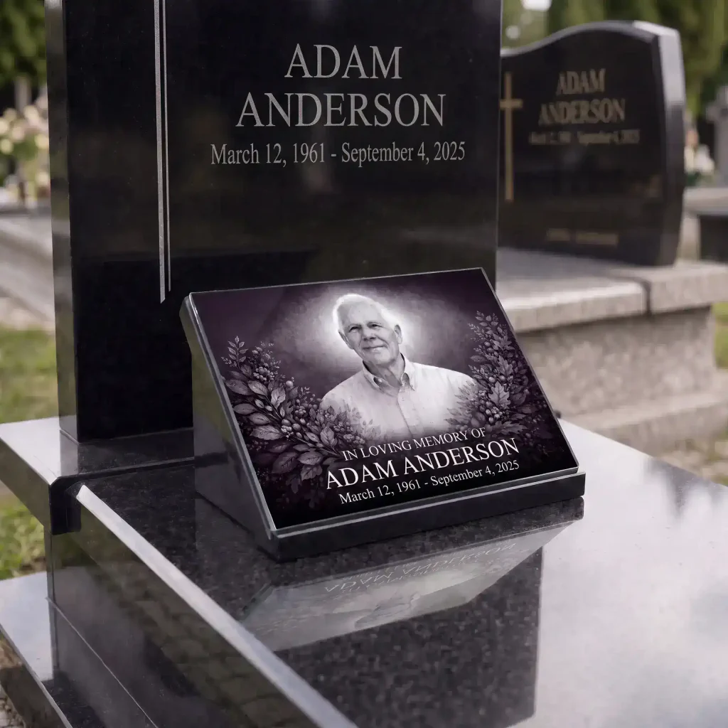 Glass photo plaque for grave featuring portrait, name and dates on headstone