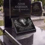 Glass photo plaque for grave with engraved portrait, name and dates on granite headstone