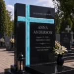 Asymmetric cross of fused glass on a black granite headstone