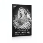 black and white glass memorial plaque with photo of deceased and floral motif
