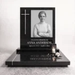 Black and white memorial photo mounted on a headstone