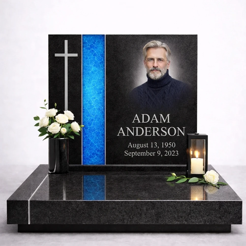 blue fused glass strip on a black granite headstone with a portrait