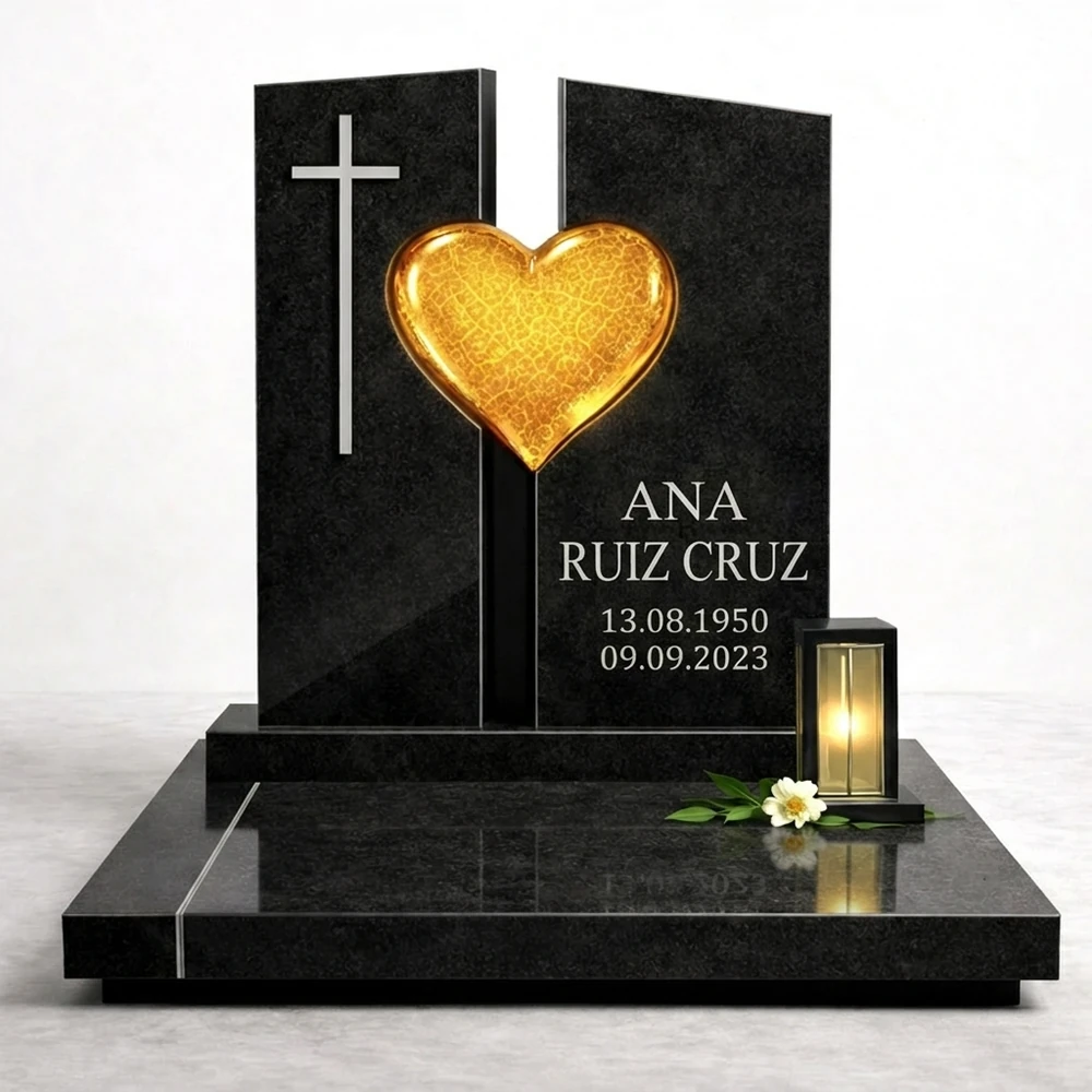 corazón de vidrio fusionado amarillo en una lápida de granito negro