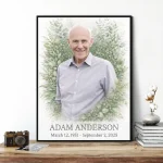 Framed memorial portrait of deceased with floral border and inscription