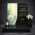 Decorative glass for a headstone with a dandelion graphic