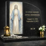 Glass panel for a headstone with an image of the Virgin Mary in a modern black granite memorial