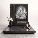 black and white photo for grave with floral engraving on granite headstone