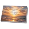 Memorial plaque in tempered glass with a sunset over the sea, on a granite base