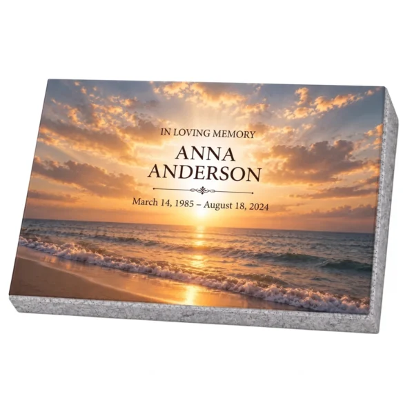 Memorial plaque in tempered glass with a sunset over the sea, on a granite base