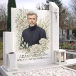Rectangular grave plaque with colour photo of deceased surrounded by rose decoration on a white headstone