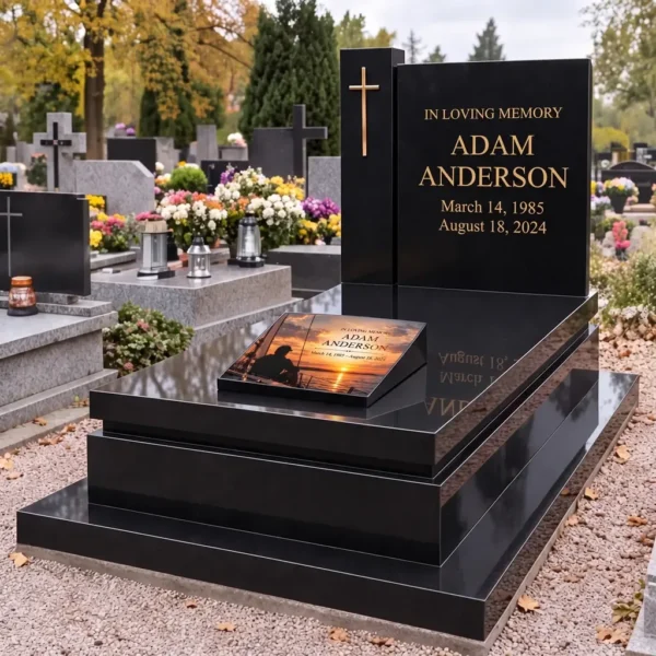 Memorial plaque with a sailor on a yacht on the slab of a black grave with a cross and gold lettering