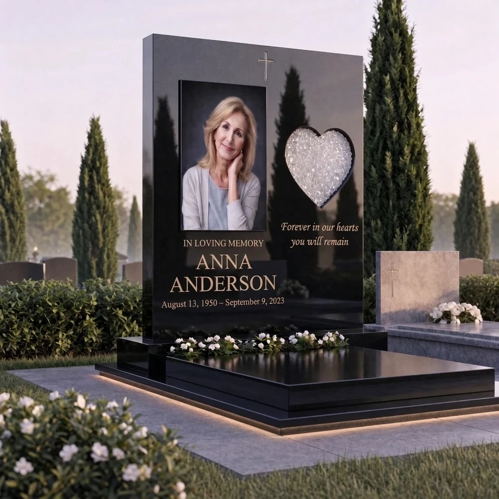 black granite memorial with a colour portrait and a white glass heart
