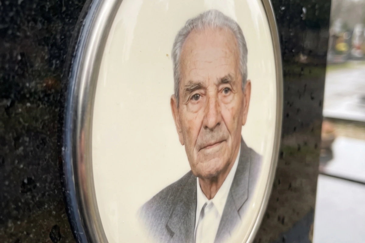 Oval porcelain portrait for headstone mounted on granite gravestone