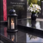 Red asymmetric glass cross bonded to a black granite headstone