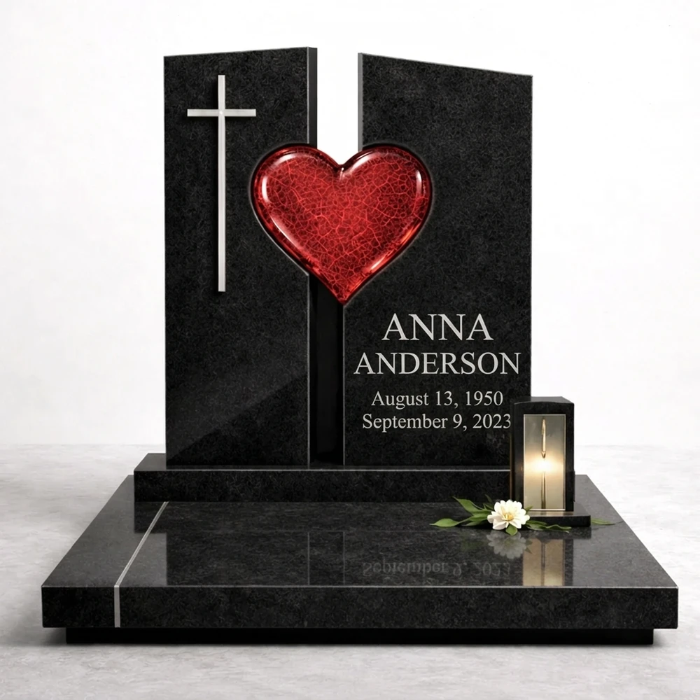 red fused glass heart on a black granite headstone