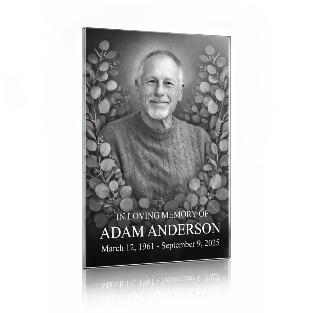 tempered glass memorial plaque with black and white photo of deceased man surrounded by floral engraving