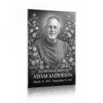 tempered glass memorial plaque with black and white photo of deceased man surrounded by floral engraving