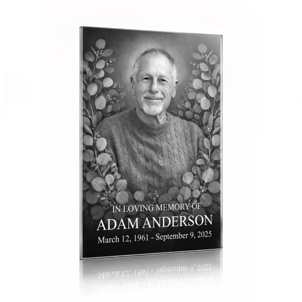 tempered glass memorial plaque with black and white photo of deceased man surrounded by floral engraving