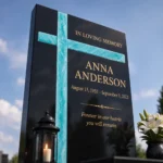 Turquoise fused-glass cross on a granite grave