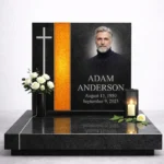 yellow fused glass strip on a black granite headstone with a portrait