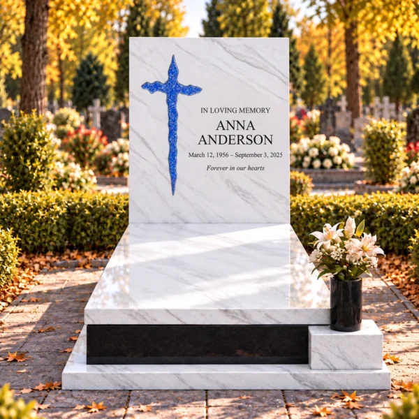blue irregular glass cross bonded into the tablet of a white stone headstone beside the inscription, front view