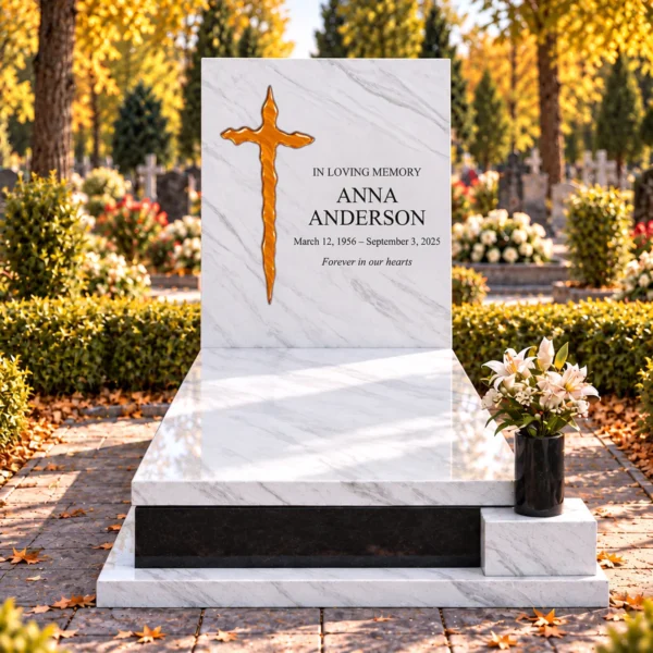 orange irregular glass cross bonded into the tablet of a white stone headstone beside the inscription, front view
