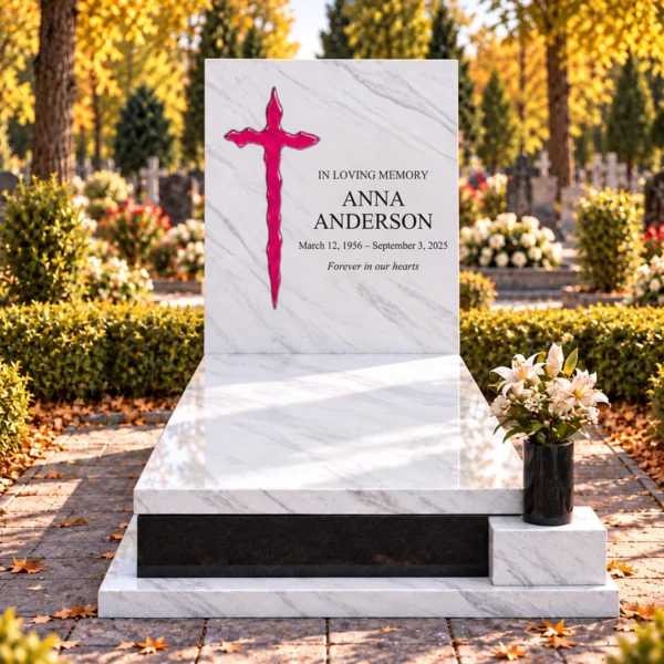 pink irregular glass cross bonded into the tablet of a white stone headstone beside the inscription, front view