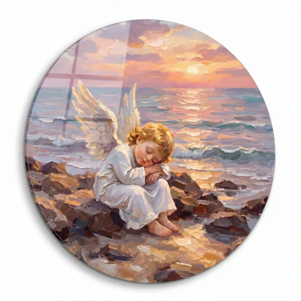 Round decorative panel for a child’s grave with a sleeping angel on rocks by the sea at sunset