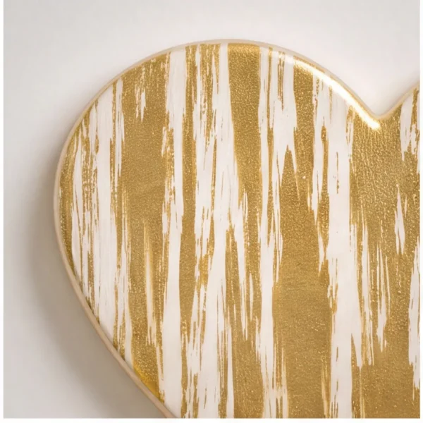 streaked gold glass heart for a headstone, close-up of the glass texture